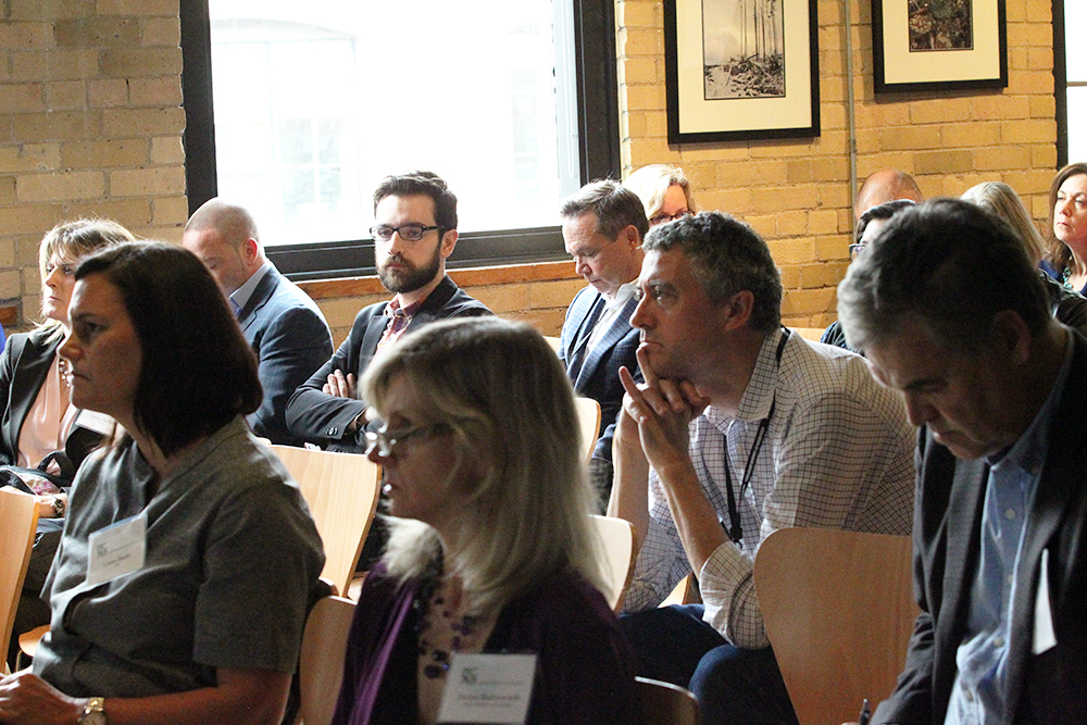 Delegates carefully listening and taking notes