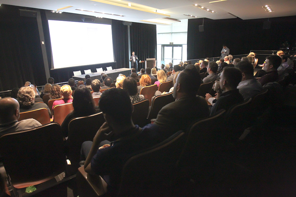 Delegates listen to the presentation by Andrew Altersohn