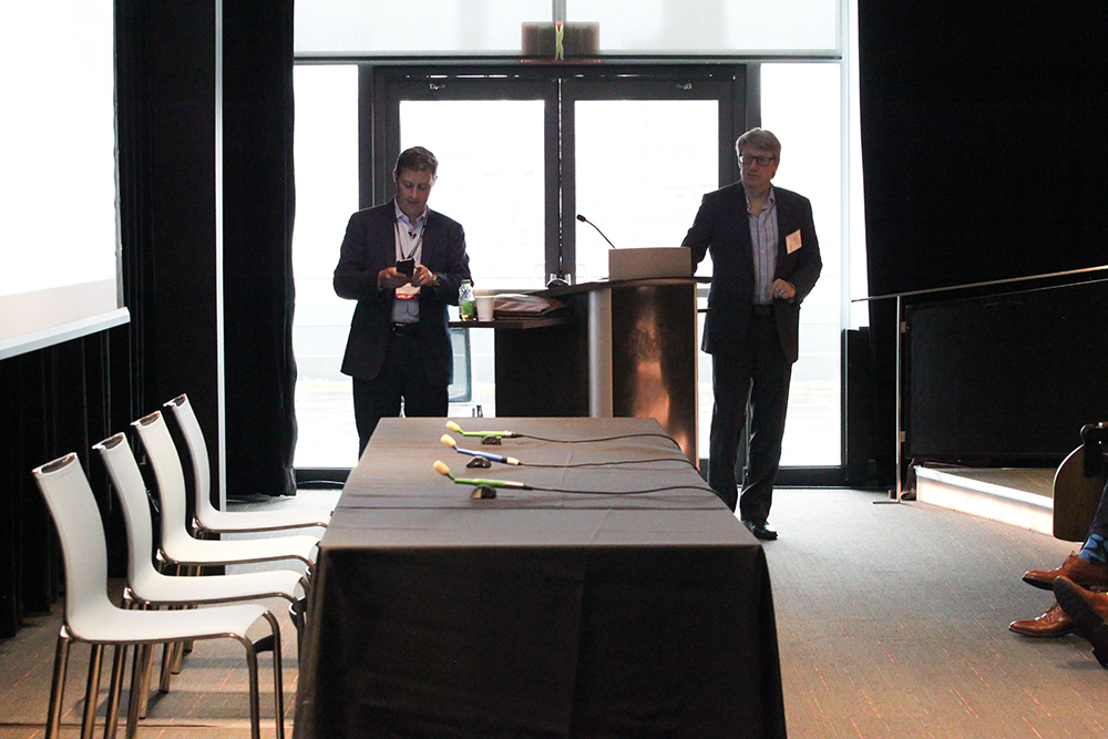 Andrew Altersohn, CEO of Ad/Fin, responds to a live poll question, while Chris Williams, ACA VP Digital, looks on